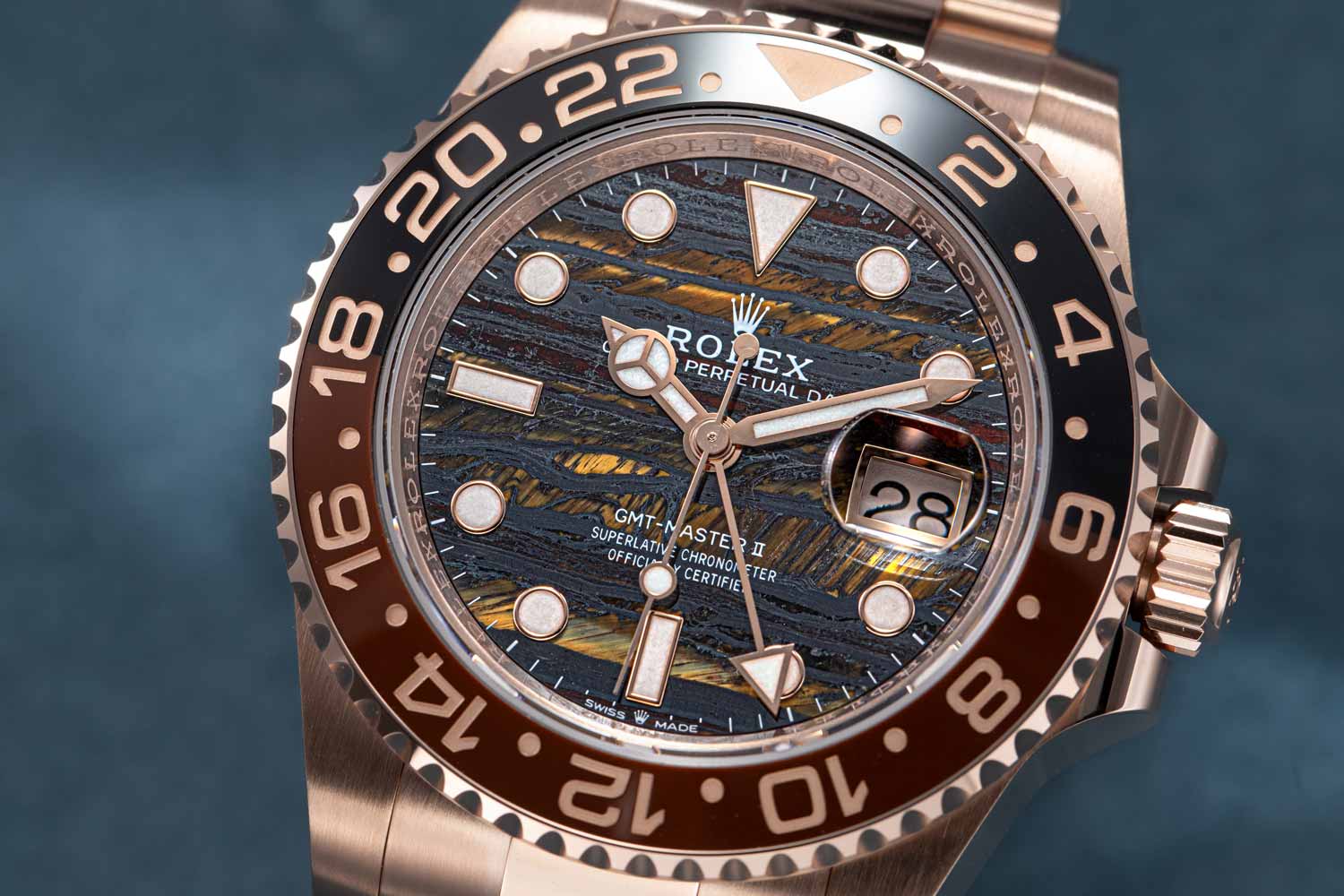 Rolex rose gold GMT-Master II luxury watch with Tiger Iron dial
